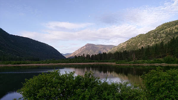 Photo of lake with mountains in background.
