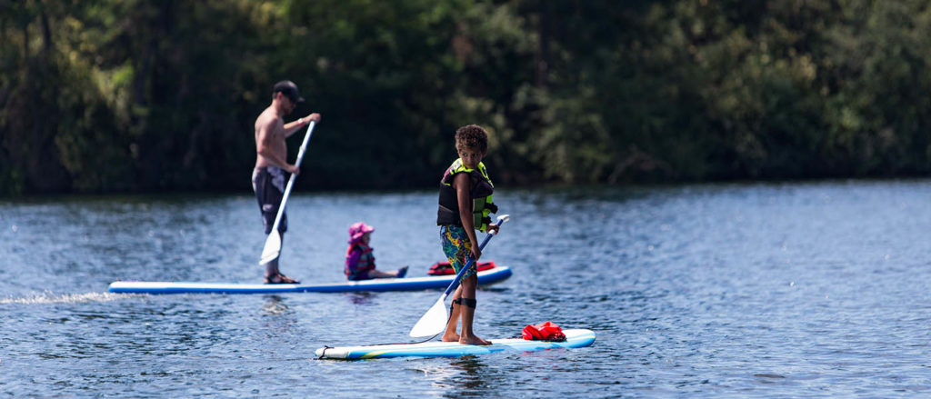 Photo of Stand Up Paddleboarders on the Spokane River.
