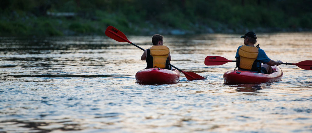 Kayaker paddling on the Spokane River.