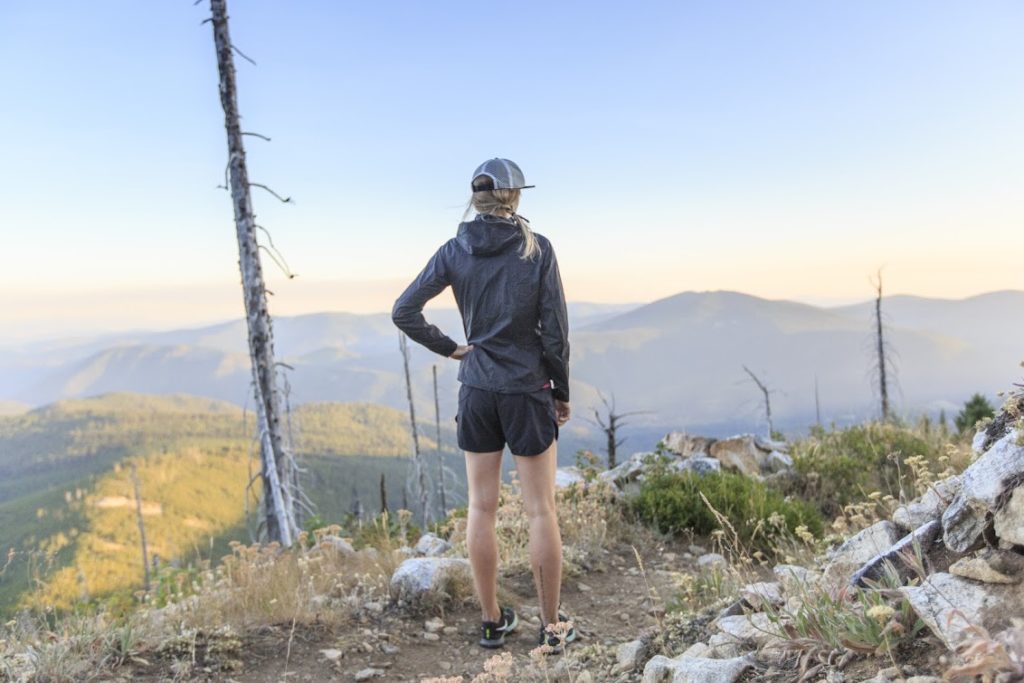 Hiker atop the Kettle Crest Range looking out on the vast landscape.