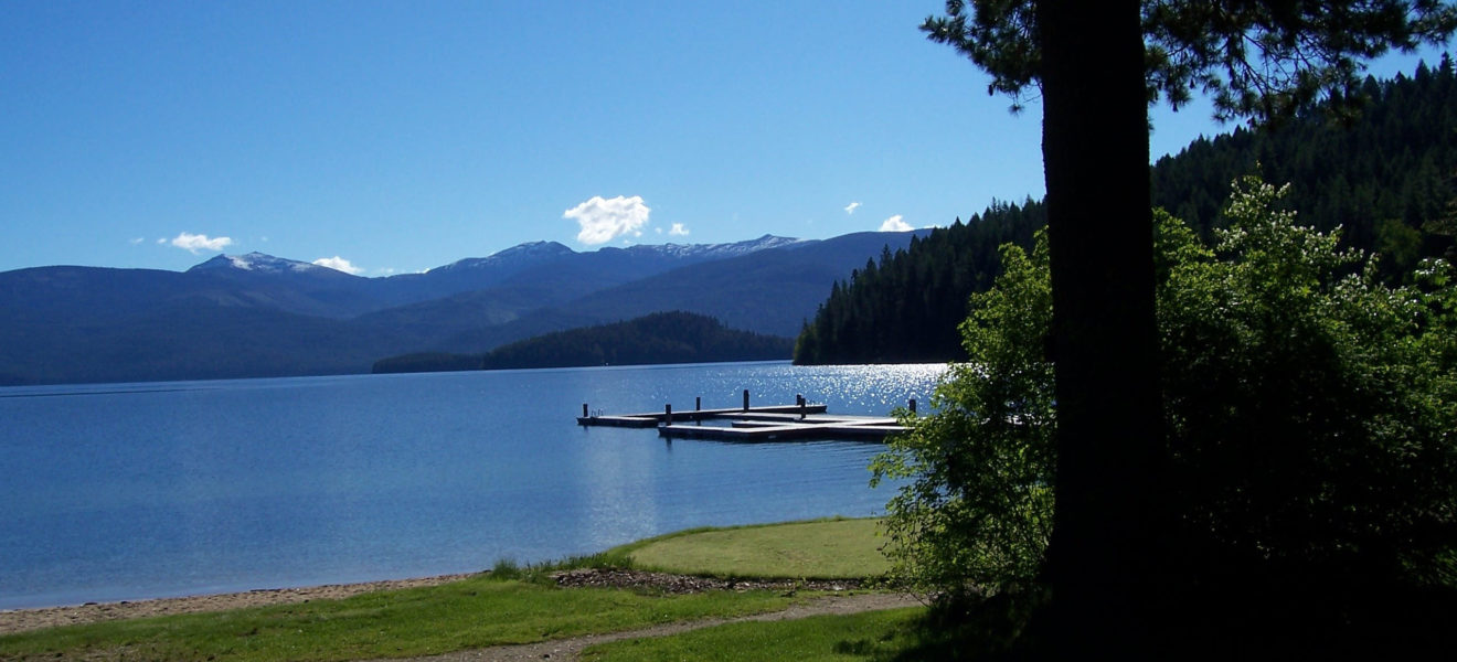 Scenic view of Priest Lake at Hill's Resort, with the resort docks and flat water.