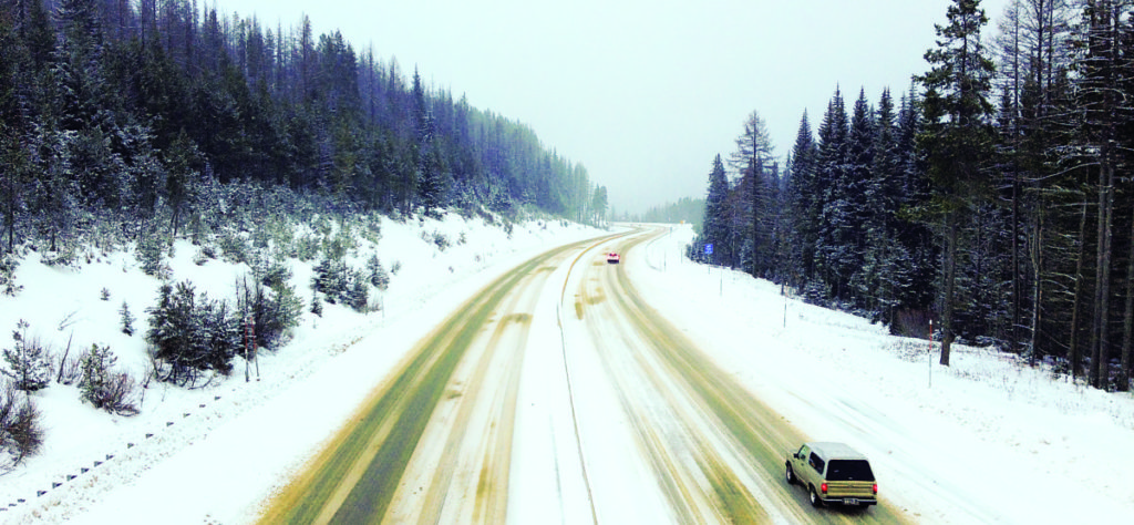 View of a snowy interstate-90 from the overpass at Lookout Pass.