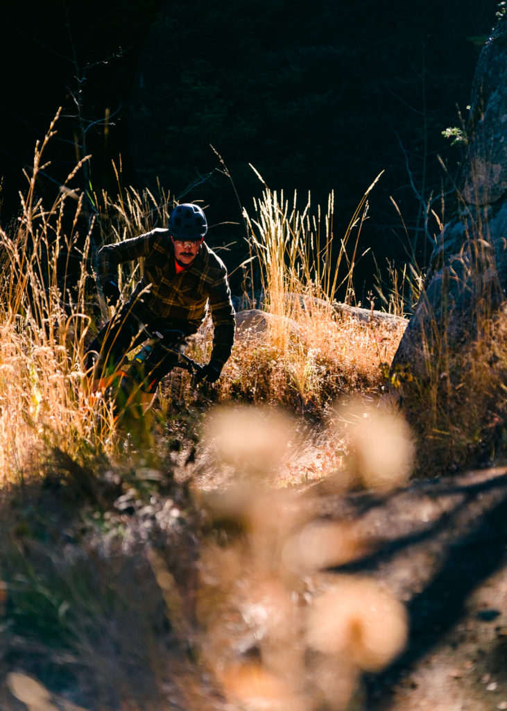 Biker rounding a singletrack corner on Jug Mountain.