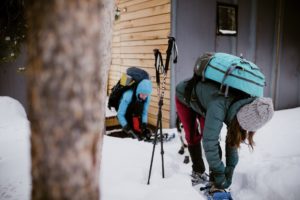 Putting on snowshoes.