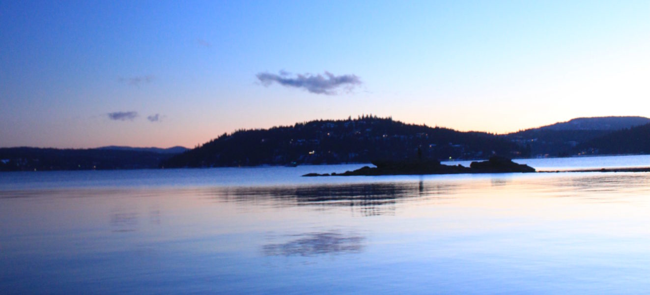 Moon over Coeur d'Alene Lake at sunset.