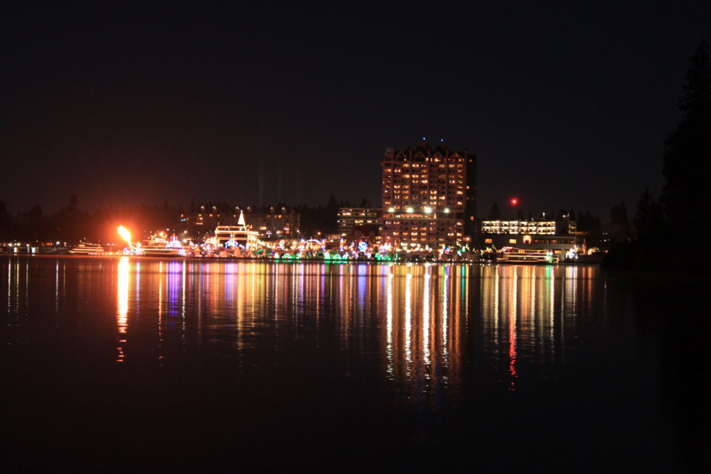 Holiday lights at the Coeur d'Alene Resort reflecting on the water of Lake Coeur d'Alene.