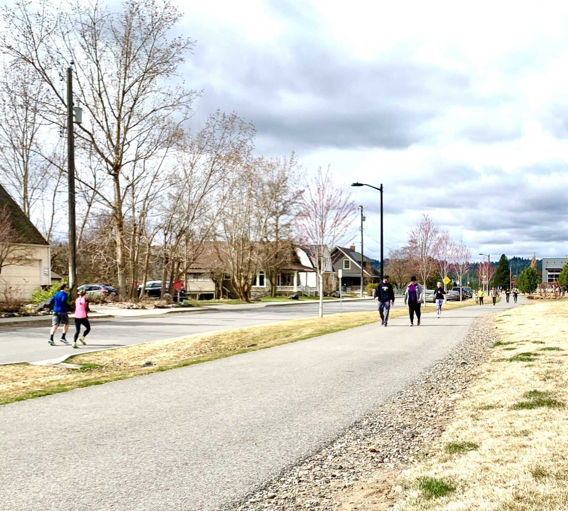 Different people on a trail, social distancing.