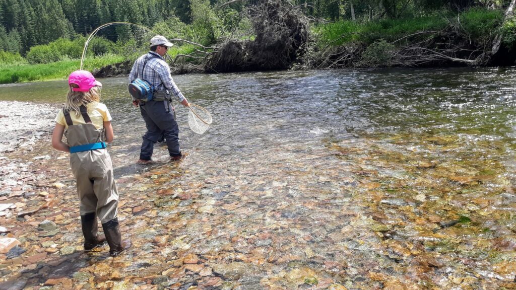 A father and daughter flyfishing.