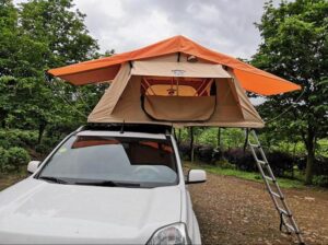 A car roof mounted tent.