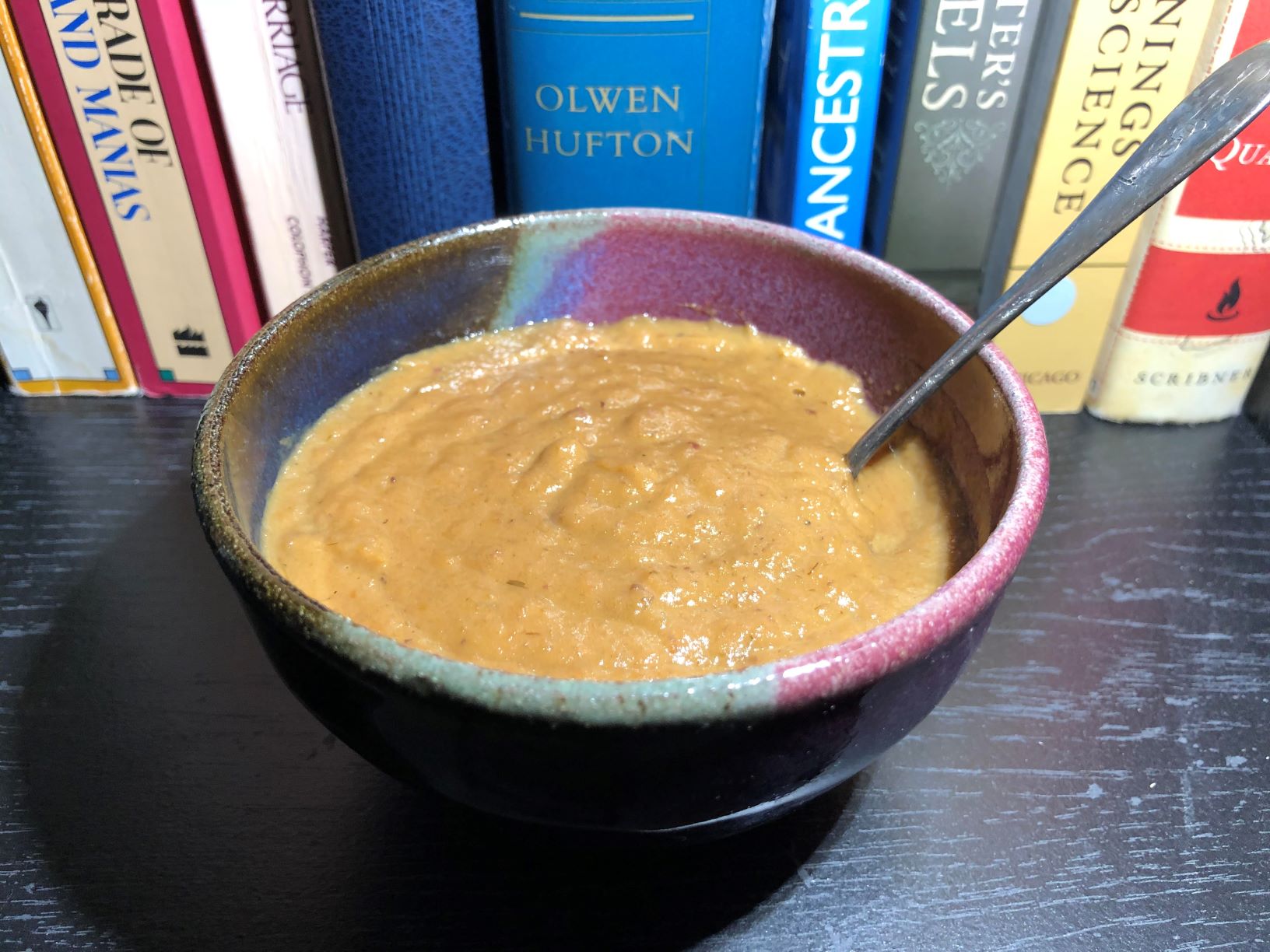 A bowl of thick tan/brown soup.