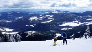 Family skiing down Mount spokane.
