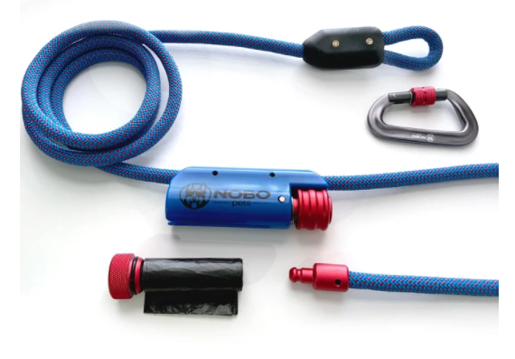 Dog leash made by NOBO Pets is constructed of climbing rope with a handle that has a built-in bag dispenser and a locking carbiner for collar clipping.