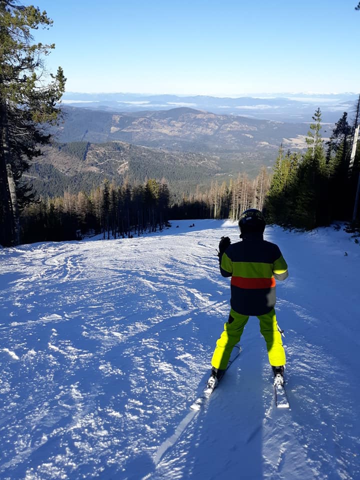 Person skiing down mountain.