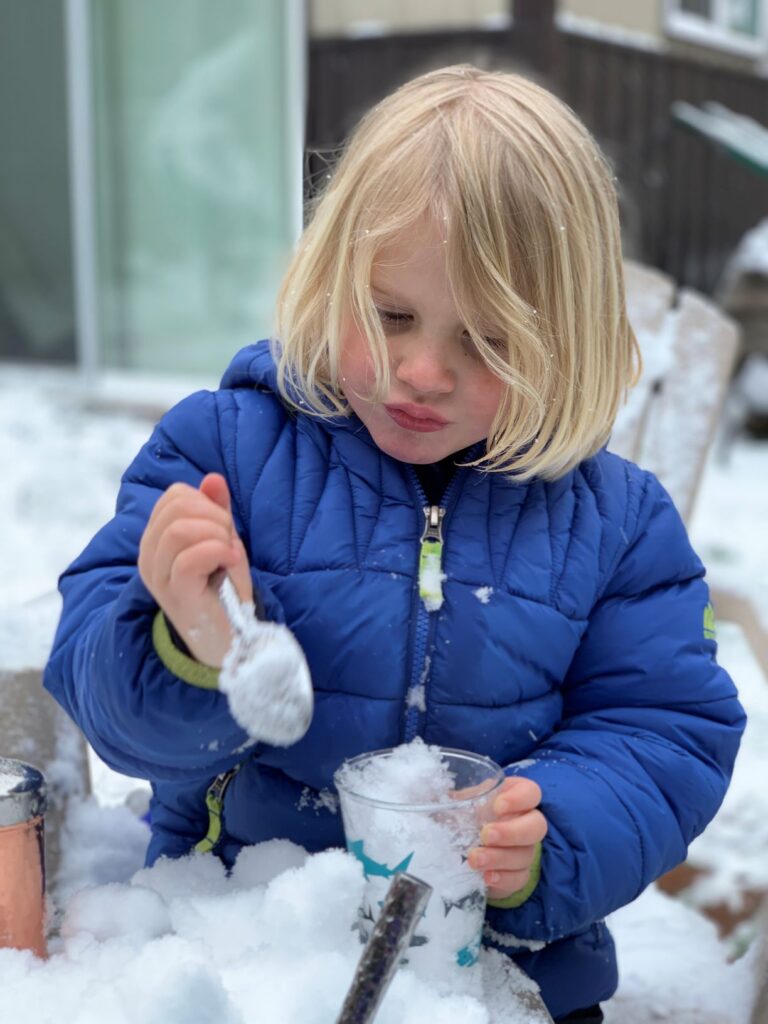 Child playing in the snow.