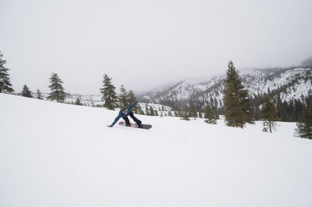 Snowboarder coming down a run at Echo Valley Ski Hill in Chelan, WA.