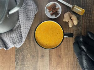 Bird-eye view of golden milk and ingredients.