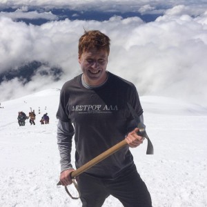 Aaron Theisen's profile of them holding a pick-axe on a snowy mountainside.