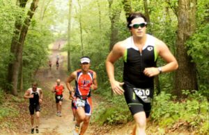 Runners running up a trail.