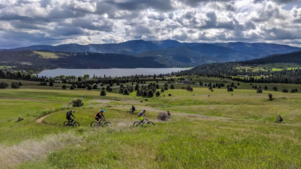 Bikers along a windy dirty trail on the Saltese Uplands area in the city of Liberty Lake, Washington.