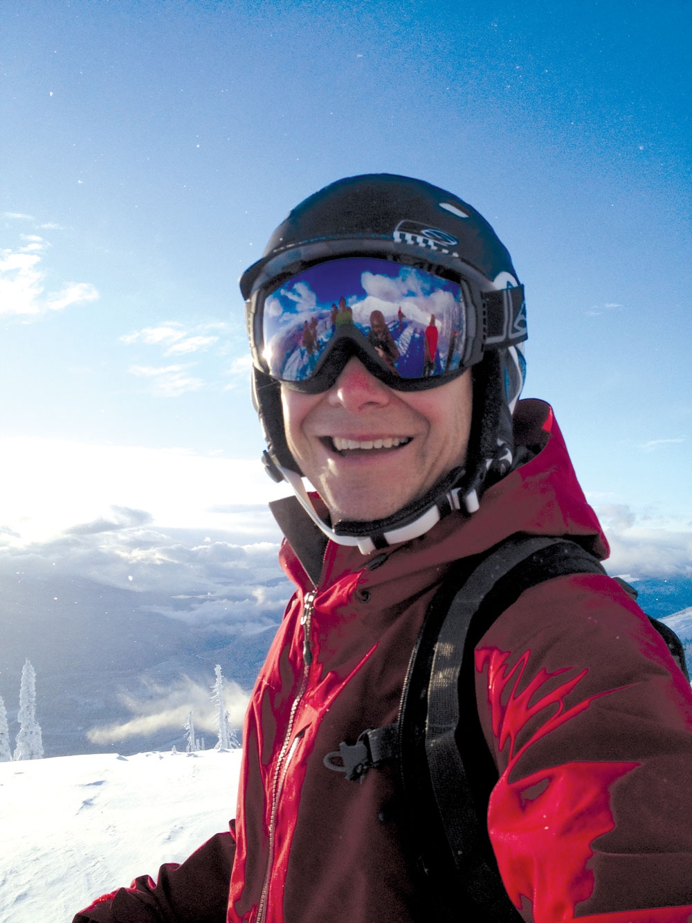 Selfie photo of Powder Matt in his ski gear on a sunny, blue sky day on the Kootenay Mountains of B.C.