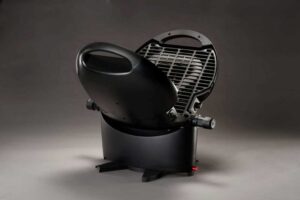 NomadiQ brand compact, portable grill -- black with base and vertical grill top.