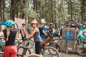 Woman ready to ride a mountain bike from the demo bike area at Spokatopia.