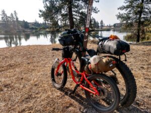 Bike loading with gear parked near Fishtrap Lake.