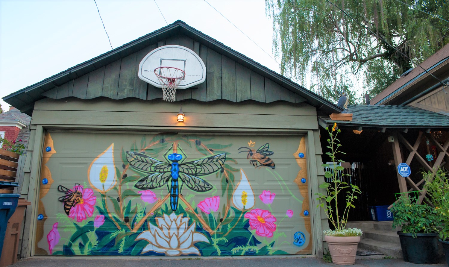 Flower mural art on a garage door.