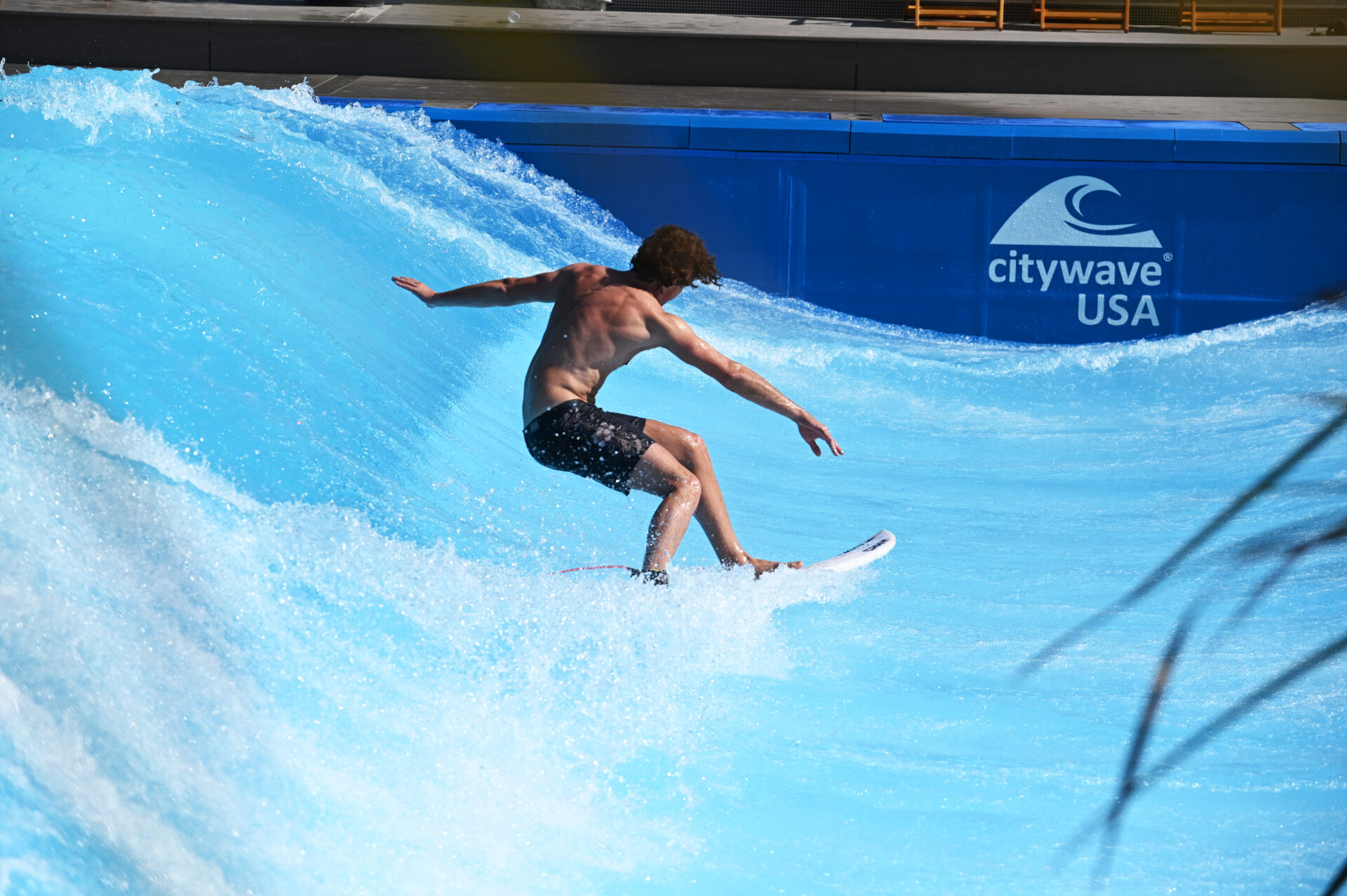 Man surfing a wave at Lakeside Surf at Slidewaters Water Park in Chelan, Washington.