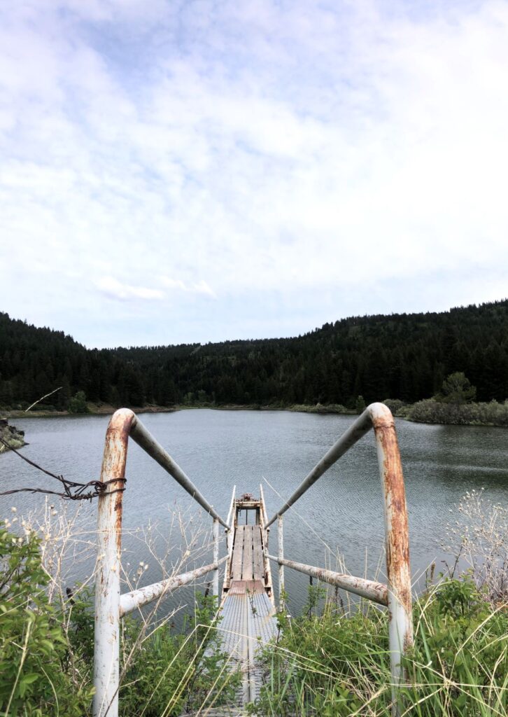 View looking down a ramp to a dock on a lake.