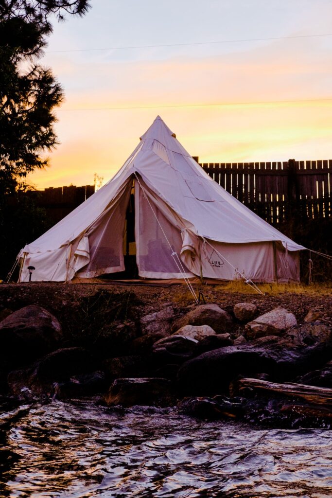 Large white canvas glamping tent on Lake Pend Oreille.