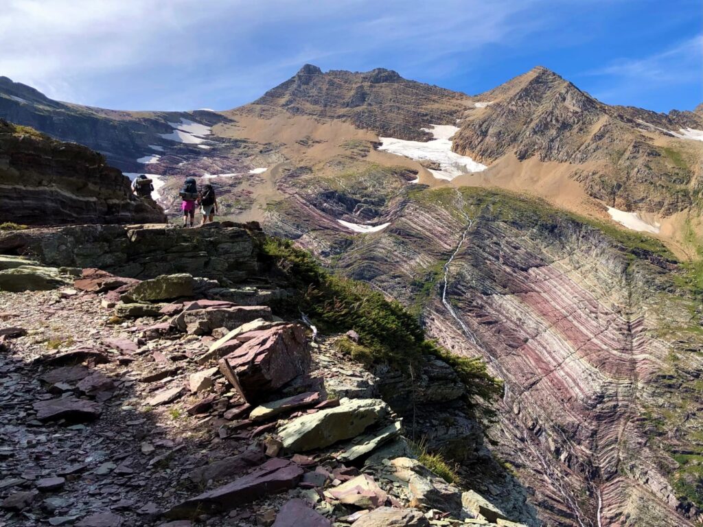 Olivia Dugenet and friends approaching a high mountain pass.