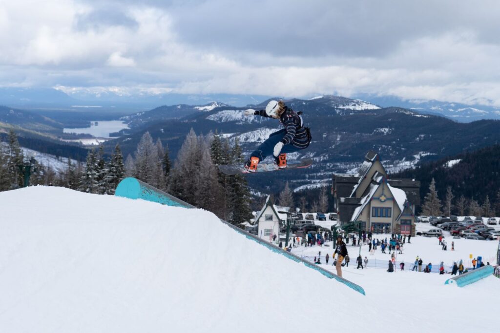 Austin Visintainer doing a trick off a terrain park rail at Mt. Spokane's Jam 4 Cans event.