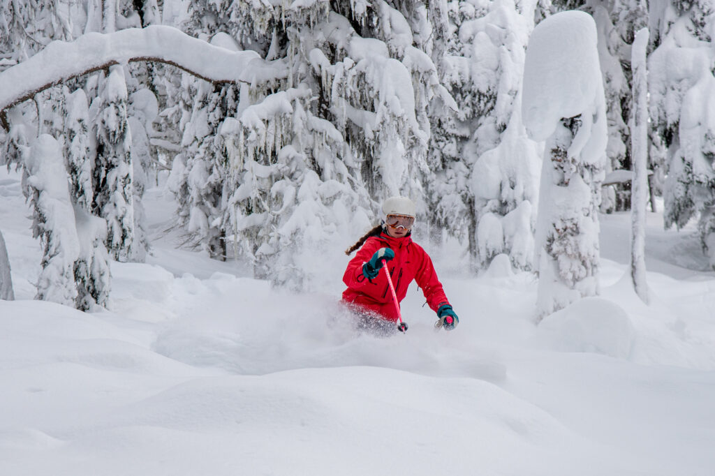 Skier making turns in deep powder at Lookout Pass in Mullan, Idaho.