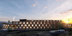 Architect rendering of exterior of Humbird -- 3 story hotel, wood exterior, and lit windows.