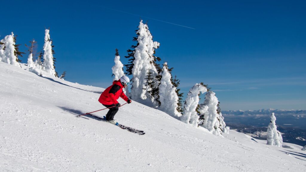 Skier in red jacket shredding at Mt. Spokane.