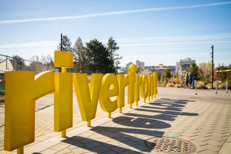 Big yellow letter-shaped signs that spell out Riverfront at Riverfront Park.