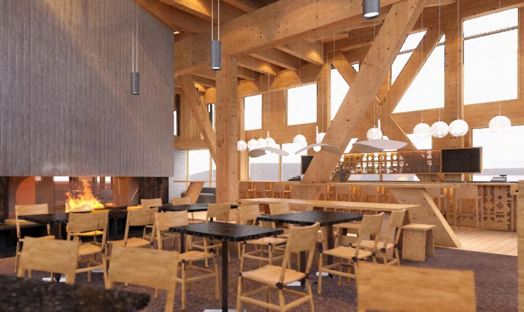 Indoors at the Crow's Nest restaurant, with light wood beam accents on the ceiling and window frames, and wood furniture.