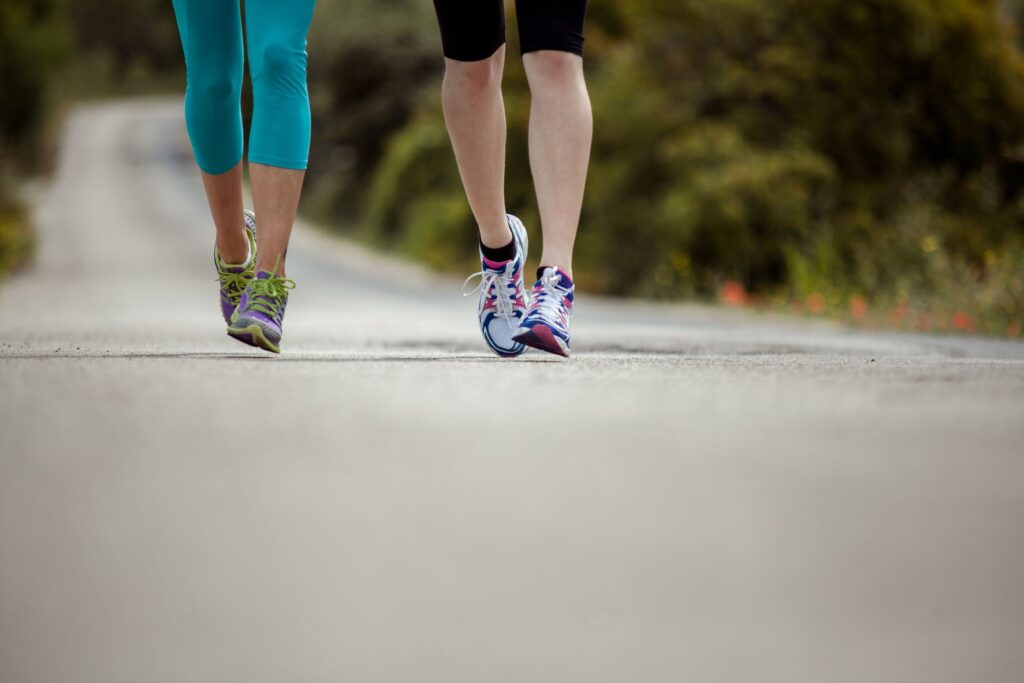 View of two runners' feet in motion.