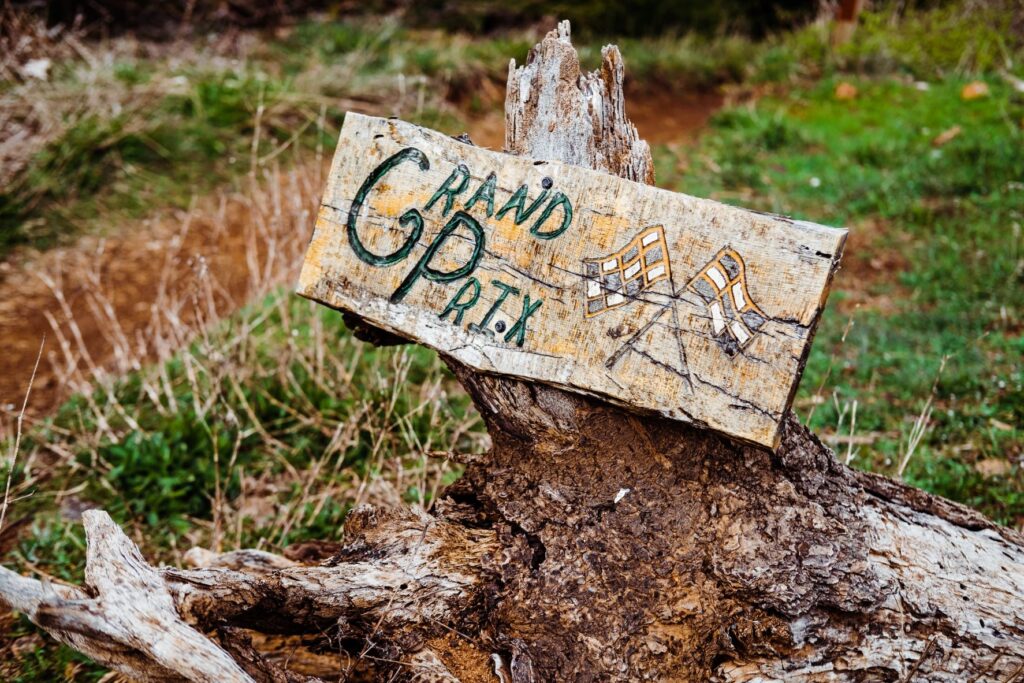 Trail signs on stumps remind riders that Post Canyon is a working timber farm. 
