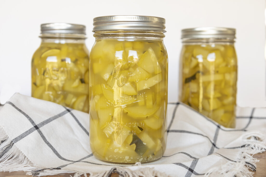Preserve the fall harvest by canning: Three glass Mason jars of pineapple zucchini.