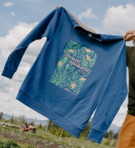 Wildland Cooperative native plant sweatshirt, "Plants of Mount Spokane" design, available at the Wildland Cooperative market at Green Bluff near Spokane, or at wildlandcoop.com.